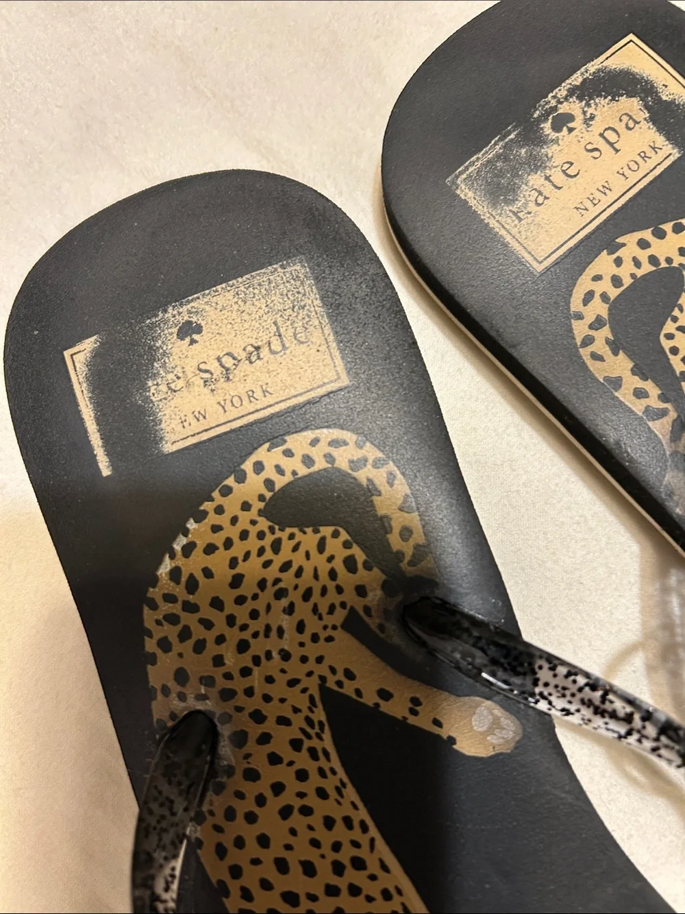 kate spade Black Leopard Print Flip Flop Sandals with Pink Floral Accent